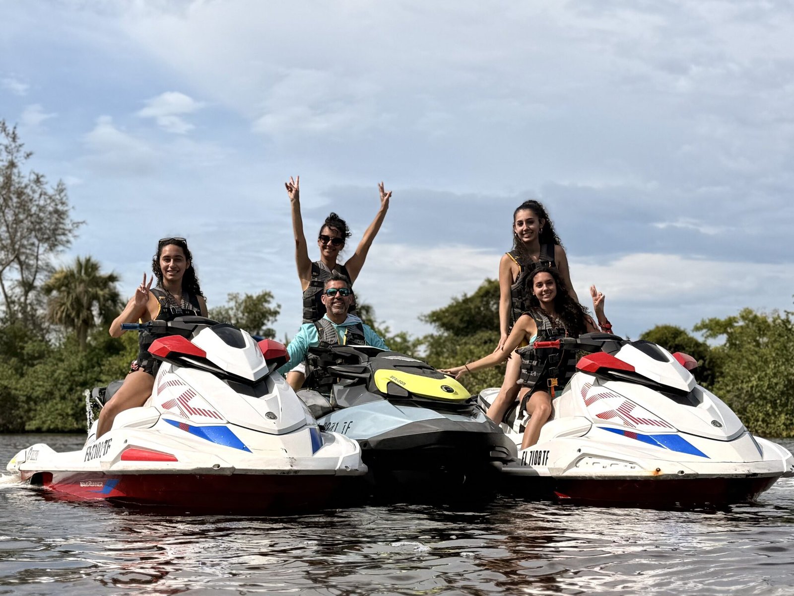 Family jet ski tour near mangrove tunnels along the Sanibel Causeway